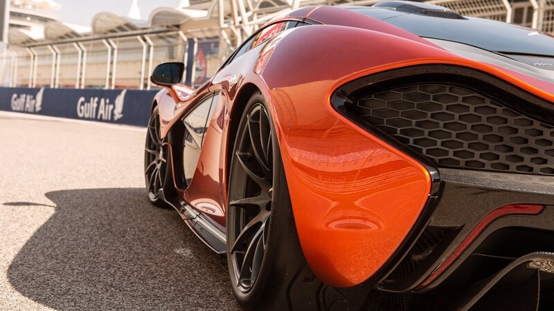 orange sports car on racetrack