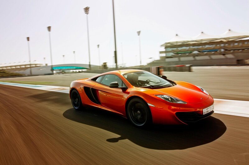 orange sports car on racetrack