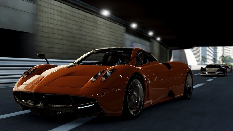 orange sports car on racetrack
