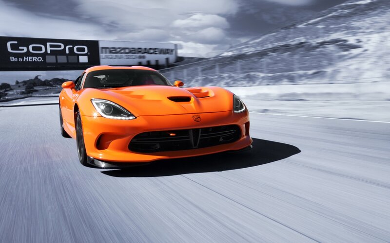 orange sports car on racetrack