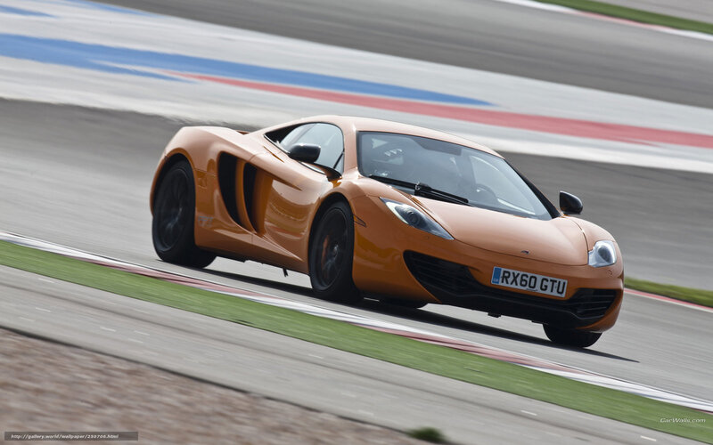 orange sports car on racetrack