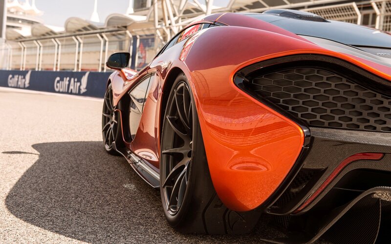 orange sports car on racetrack