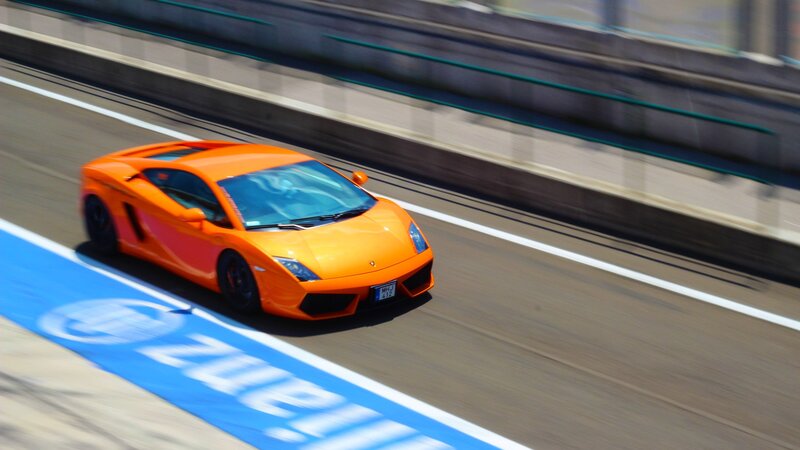 Orange sports car on racetrack