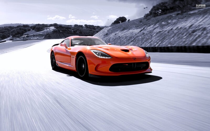 orange sports car on racetrack