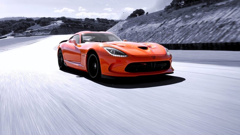 orange sports car on racetrack