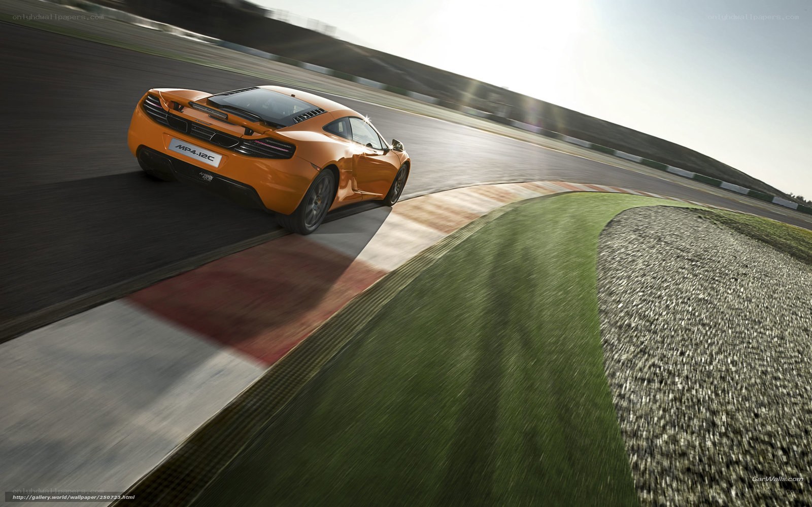 orange sports car on racetrack