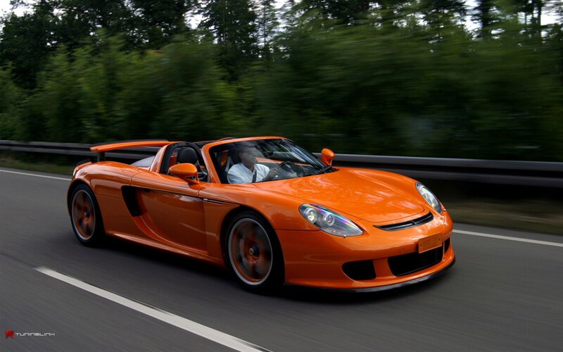 orange sports car on road