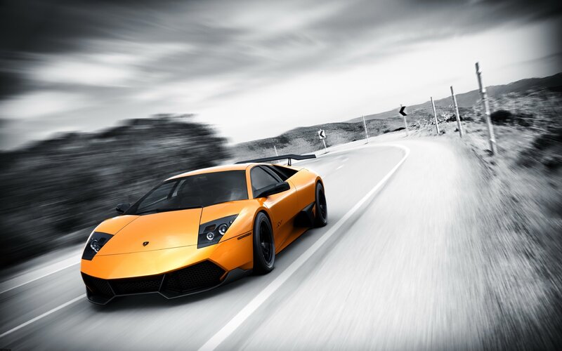 orange sports car on road