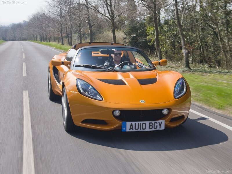 orange sports car on road