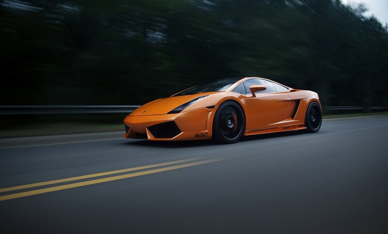 orange sports car on road