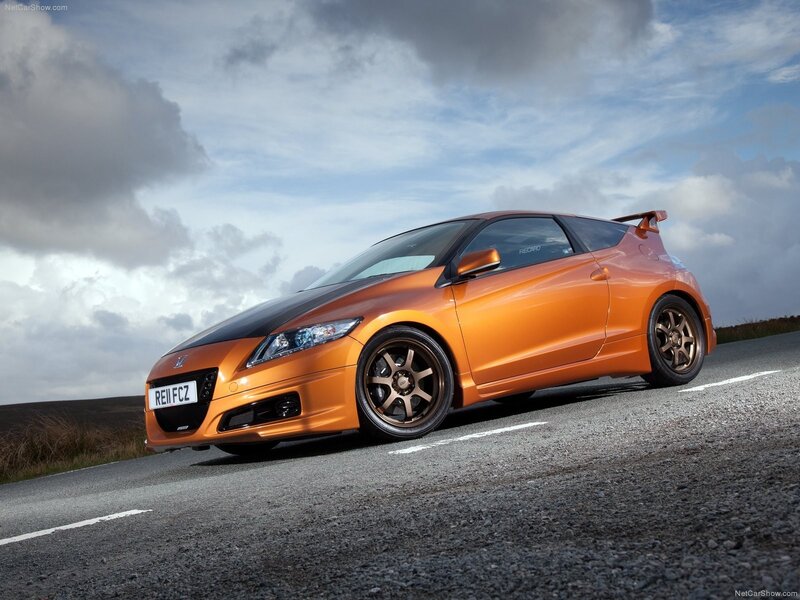orange sports car on road