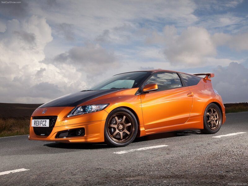 orange sports car on road