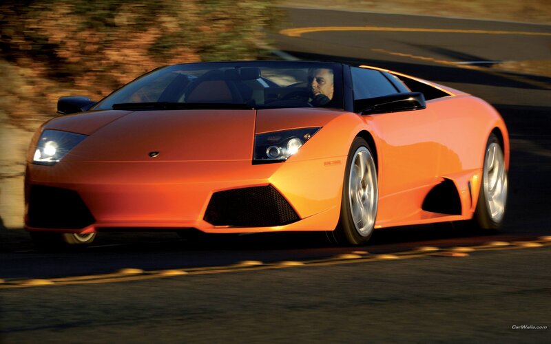 orange sports car on road