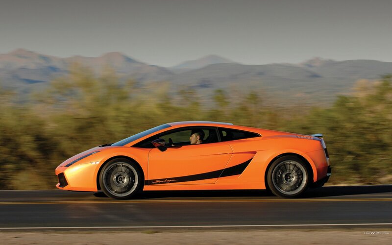 orange sports car on road