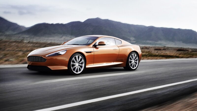 orange sports car on road