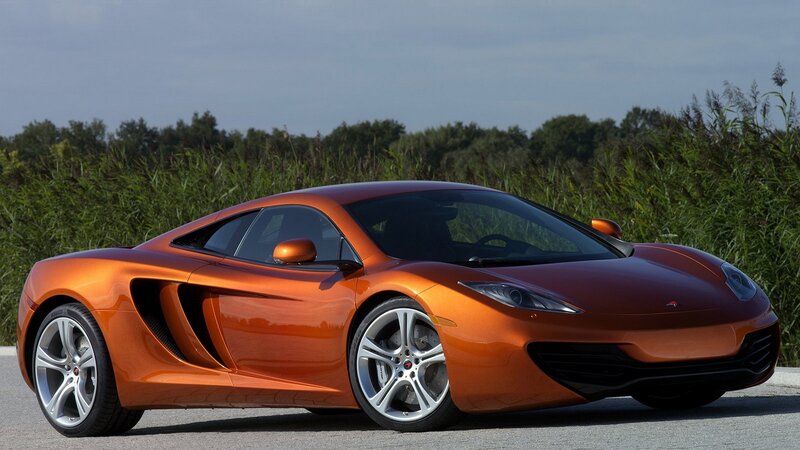 orange sports car on road