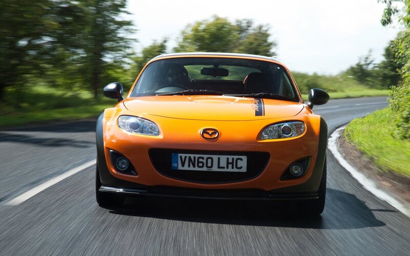orange sports car on road