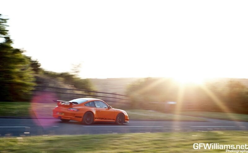 orange sports car on road