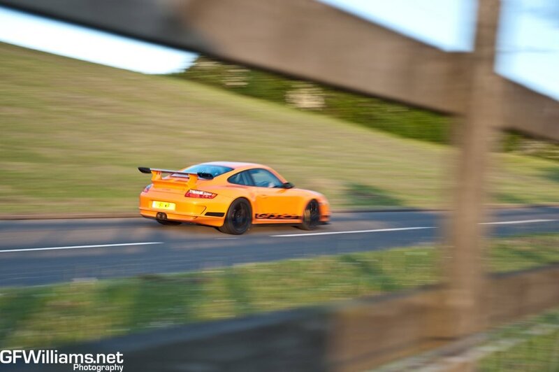orange sports car on road