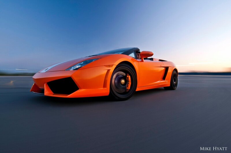 Orange sports car on road
