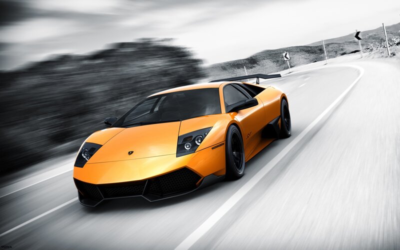 orange sports car on road