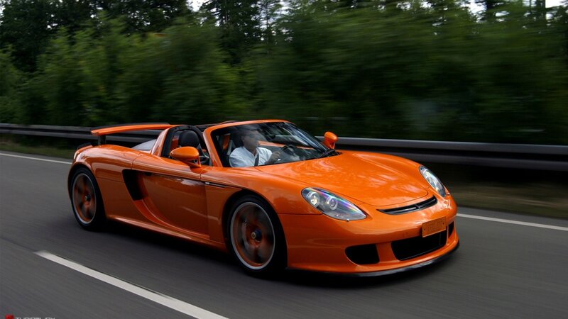 orange sports car on road