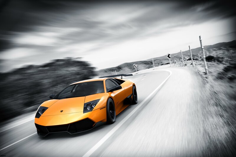 orange sports car on road