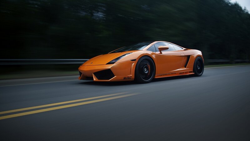 orange sports car on road