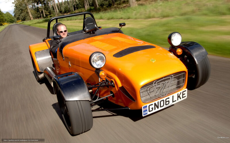 orange sports car on road