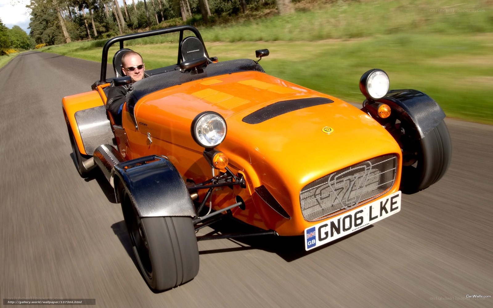 orange sports car on road