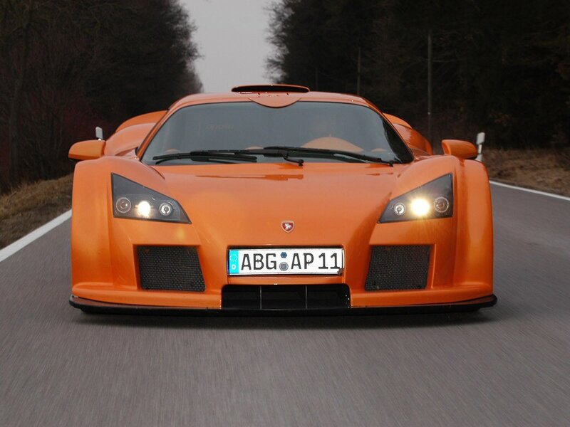 orange sports car on road