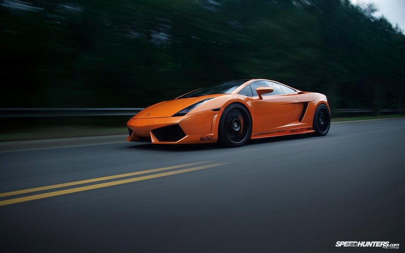 orange sports car on road