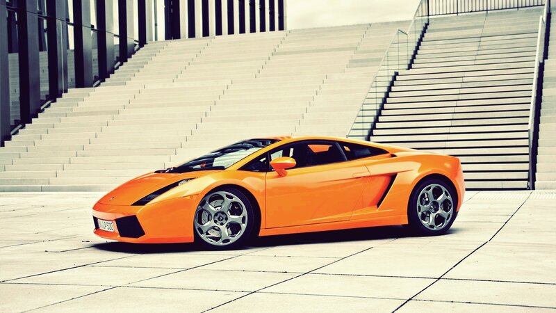 Orange sports car on stairs