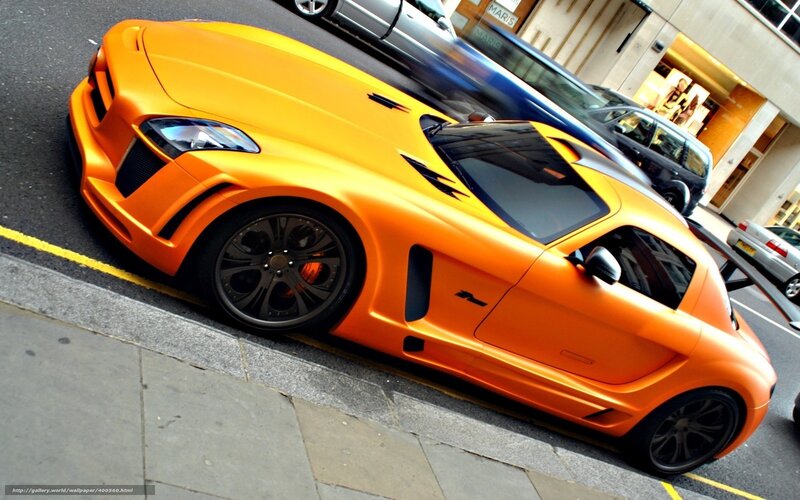orange sports car on street