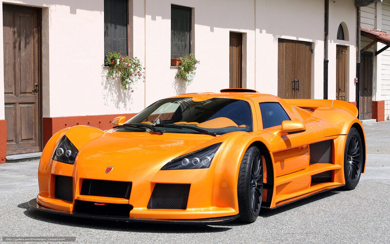 orange sports car on street