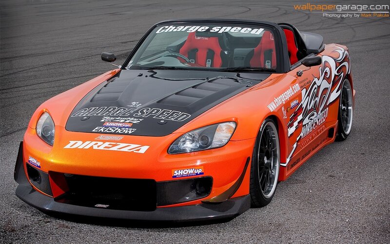 orange sports car on track
