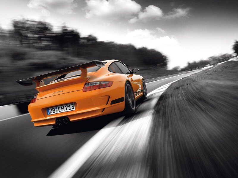 orange sports car on track