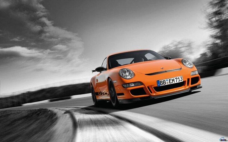 orange sports car on track