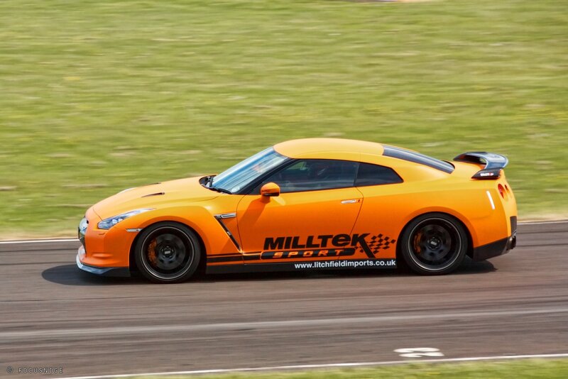 orange sports car on track