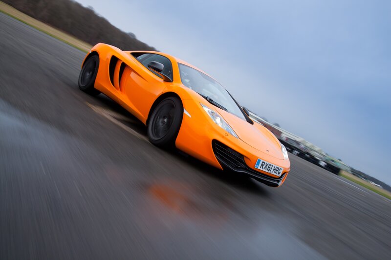 orange sports car on track