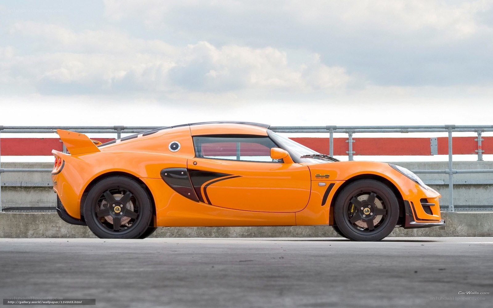 orange sports car on track