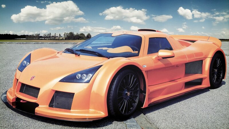 orange sports car on track