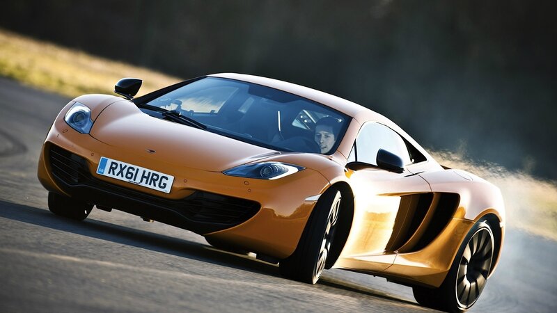 orange sports car on track