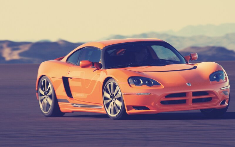 Orange sports car on track