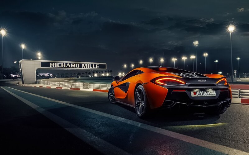 Orange Sports Car on Track — Dramatic, Night