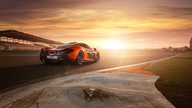 Orange Sports Car on Track — Dramatic, Sunset