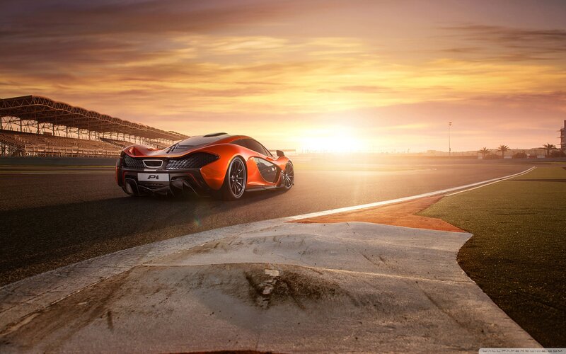 Orange Sports Car on Track — Dramatic