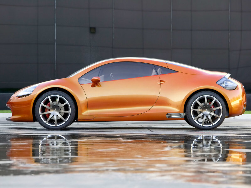 Orange sports car on wet pavement