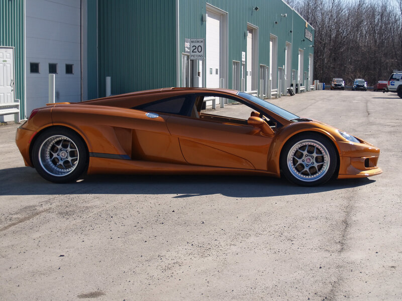 orange sports car parked outside