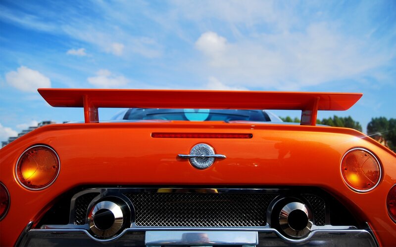 orange sports car rear view